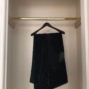 Patterned black and gold shawl.